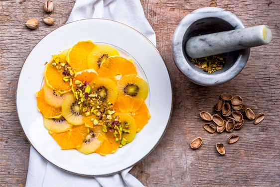 Carpaccio di Arance e Kiwi SunGold con granella di Pistacchi